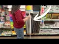 She buys a GIANT Dollar Store poster board for this genius living room idea