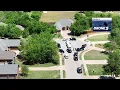 Drone shows police investigating after 5 found dead at Yukon home