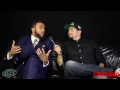 Two Grown Men On A Little Couch With Jidenna
