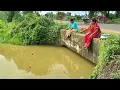 Download Lagu Fishing Video || Two fisherwomen fishing in the canal with a hook on the side of the national road