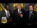 President Donald Trump joins Kenny Albert and Jonathan Vilma in the broadcast booth in Washington