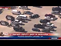 SUSPECT SEARCH Deputies look for suspect near sheriff s department in CA