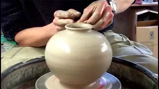 Making Throwing A Spherical Shaped Pottery Vase On The Wheel 