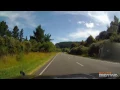 Car towing trailer fishtails after coming around a corner