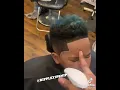 Baltimore barber accidentally sprays kid in the eyes