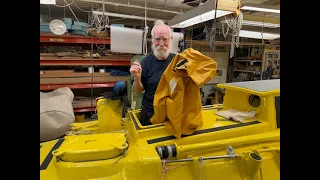 My foul weather jacket. Putting it on inside boat.