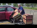 Unloading balikbayan boxes in Chicago to ship to the Philippines
