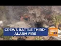 Firefighters battling fire spreading to several buildings in central Phoenix
