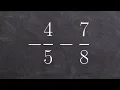 Learn how to subtract a fraction from another negative fraction