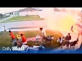 Moment family s front lawn fireworks party turns into a WAR ZONE as box of rockets catches fire