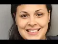 Woman sports a HUGE smile in her p olice mugs hot after cutting her boyfriend with a sword