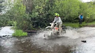 Mark crossing the creek on his Beta
