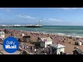 People soak up the rays on Brighton beach amid heatwave weather