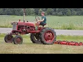 Farmall Cub pulling a 7 Gang Reel Mower