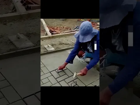 Africans making tiles designing with a cement