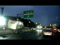 shows box truck on highway barrier