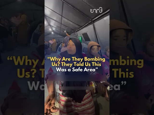 ⁣A Palestinian woman cries out asking, 