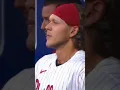 Alec Bohm cuts his neck while smashing his bat in the dugout after striking out on a very high pitch