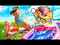 Maya is playing in the pool and making a ball pit for her baby doll