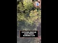 Officers rescue man from burning car