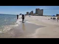 Walking along the shore at Gulf Shores Public Beach