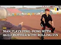 Download Lagu Man in China plays ping-pong with 82-year-old mother using a rolling pin