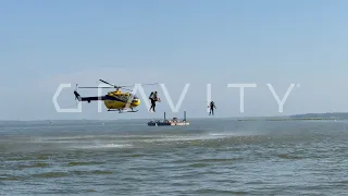 2 Jet Suit pilots in formation with Messerschmitt Bo 105CB helicopter at Oshkosh.