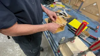 Holes instead of hookes, simpler, lighter, cheaper, and I get the center of gravity lower.