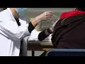 CDC says people can get COVID-19 booster flu shot at the same time