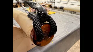 Making anchor points on the yards for sails.