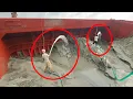 Download Lagu Just two workers are unloading sand from the bottom of the ship with the help of a dredger machine