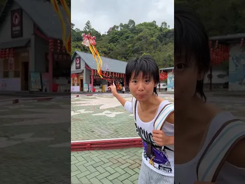 The girl started flying in the air and showered flowers on the people.