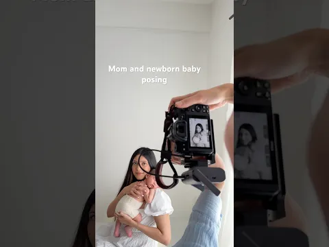 Mom and newborn baby posing