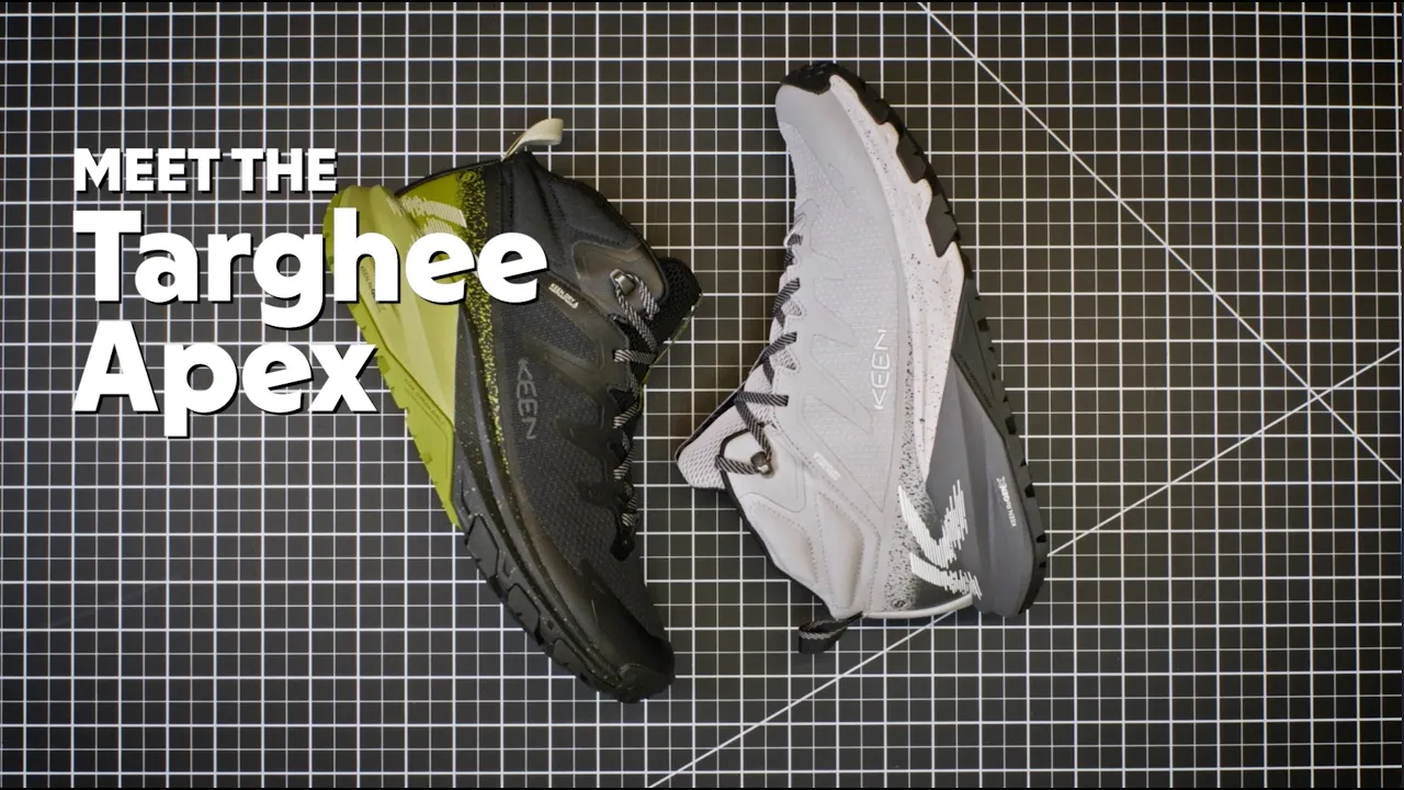 The video opens with a close-up of a black and neon green KEEN hiking boot, held by two hands against a black grid…