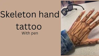 skeleton hand tattoo with pen art creativechick
