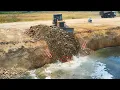 Download Lagu Be Incredible skills Dozer to push rocks into the lake with trucks working together to dump rocks.