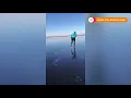 Skaters slide across a lake in the Netherlands