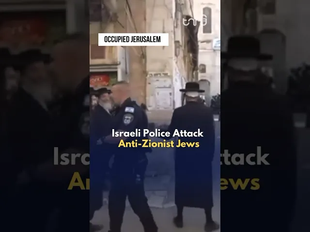 ⁣Israeli police brutally attack orthodox Jews for displaying Palestinian flags.
