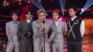 bts accepts the 2021 american music award for artist of the year the american music awards