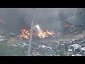 Sky5 over explosions roof collapse during junkyard fire