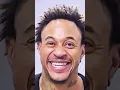 Orlando Brown smiles in his mugshot picture