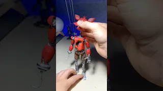 Assemby of Foxy FNAF action figure