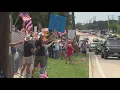 Download Lagu Protesters gather along the roadside in Flower Mound for 'No Kings' rally
