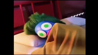 Blue cartoon with green hair getting excited on bed trending meme template