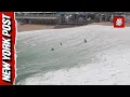 Drone captures moment giant wave swallows up swimmers on Mexican beach