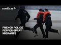 Download Lagu French police use pepper spray to stop migrants crossing the Channel to UK on small boat
