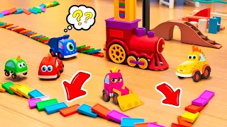 The toy cars are playing with a domino train in the room.