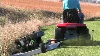 Kunz AcrEase 60 Pull Behind Finish Cut Mower Towed By A Riding Mower