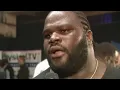 Mark Henry attempts to lift the legendary Thomas Inch Dumbbell with one hand (WWE Network)