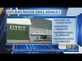 Two arrested after fight at Studio Movie Grill employee hit with gun